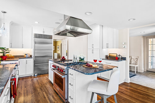 2934 Ewing white kitchen with red accents and dark countertops