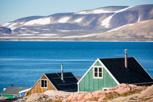 colorful houses in Ittoqqortoormiit, eastern Greenland at the entrance to the Scoresby Sound fjords Secret Atlas