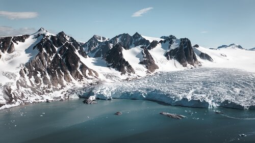 Drone shot of snow capped mountains Secret Atlas
