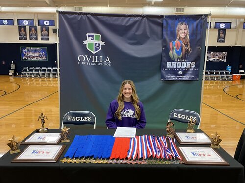 Emma Rhodes sign signing with Ouachita Baptist OBU to run cross country and track