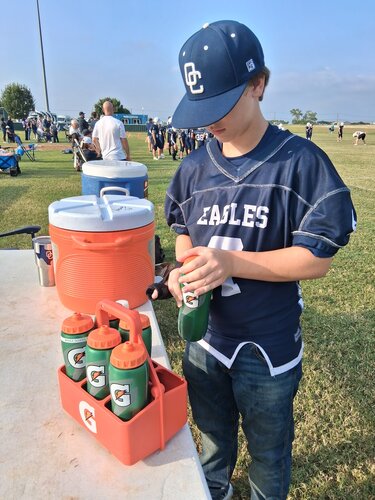 water boy at the varsity football game