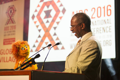 21st International AIDS Conference (AIDS 2016), Durban, South Africa.
Photo shows the Global Village Opening Ceremony. KwaZulu-Natal MEC for Health Dr Sibongiseni Dhlomo and Kami fom Takalane Sesame speak during the Global Village opening ceremony, 17 July, 2016.
Photo©International AIDS Society/Rogan Ward)