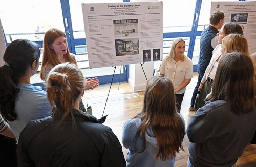 Bridget McGann ’26, left, and Lily Moore ’26 present “The Importance of Providing Healthy Fueling Options at the Athletic Center” during the Entrepreneurship Pathway poster session at the seventh annual All-College Symposium Thursday, November 6, 2025. (Connecticut College photos by Sean D. Elliot)