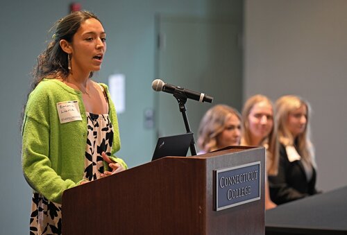 Emma Luna ’26 presents “Integrating Indigenous Knowledge: Incorporating Traditional Hawaiian Medicine into Western Health Systems” during a Public Health pathway panel session with Olivia Cook ’26 presenting “Caring for Caregivers: Impact of Nursing Demands on Health and Patient Outcomes”,  Grace McDonough ’26 presenting “The Superpower of Talking: Using Human Connection to Enhance Wellbeing”, and Sophie Sperry ’26 presenting “Environmental Health and Political Inequality: How Disparities Shape Voting Across Socioeconomic Classes” at the seventh annual All-College Symposium Thursday, November 6, 2025. (Connecticut College photos by Sean D. Elliot)