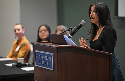 Eisha Giran ’26 presents “Invisible Shipwrecks & Neurological Endangerment: The Trade-Off in Seeking Asylum”, during the CISLA panel session with Anna Olivia Nielsen ’26, Stephanie Reyes Bravo ’26 , and Delaney Brenner ’26 at the seventh annual All-College Symposium Thursday, November 6, 2025. (Connecticut College photos by Sean D. Elliot)