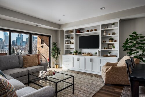 built in with tv, storage, and cabinetry