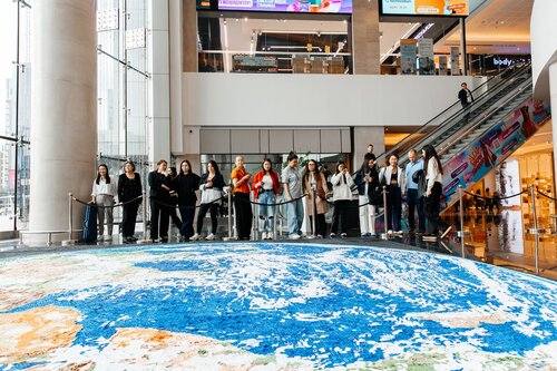 Astana, Kazakhstan — Kazakh artist Alina Akhmetbek presents 72 Voices of Earth, a monumental large-scale quilling mosaic that merges paper art, environmental symbolism,  and conceptual storytelling into a single immersive artwork. The project was publicly demonstrated on April 22, 2026, in celebration of Earth Day, as a World Guinness Records attempt to create the largest paper quilling mosaic image of Earth.
Measuring 41.66 square meters, the artwork consists of 72 individual pieces and more than 300 hundred thousands of individually hand-rolled paper elements arranged into a highly detailed representation of Earth. Entirely handmade over the course of six years, every quill was rolled by hand and carefully applied onto wooden boards to create the final mosaic. 

The mosaic is structured through two interconnected conceptual systems: the symbolism of the number 72 and the geometry of the logarithmic spiral.