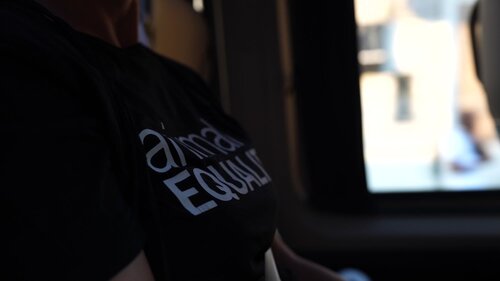 Detail of the shirt of an Activist on the van on the way to the action