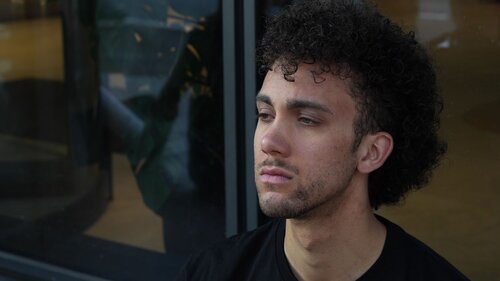 Detail of an Activist face, chained at the doors of Sodexo in Paris